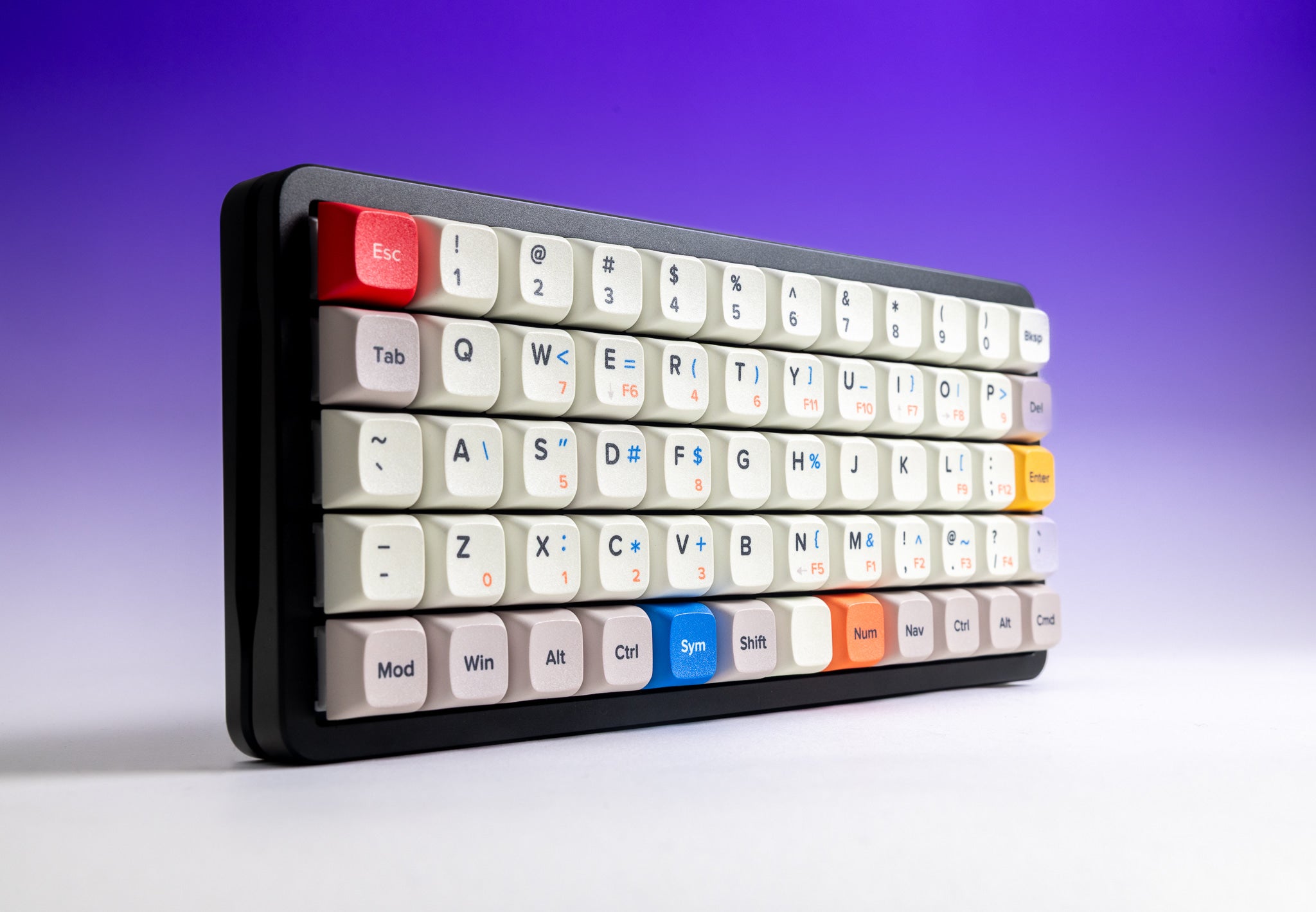 Preonic Rev 4 at an angle showing the aluminum case profile and QWERTY keycaps